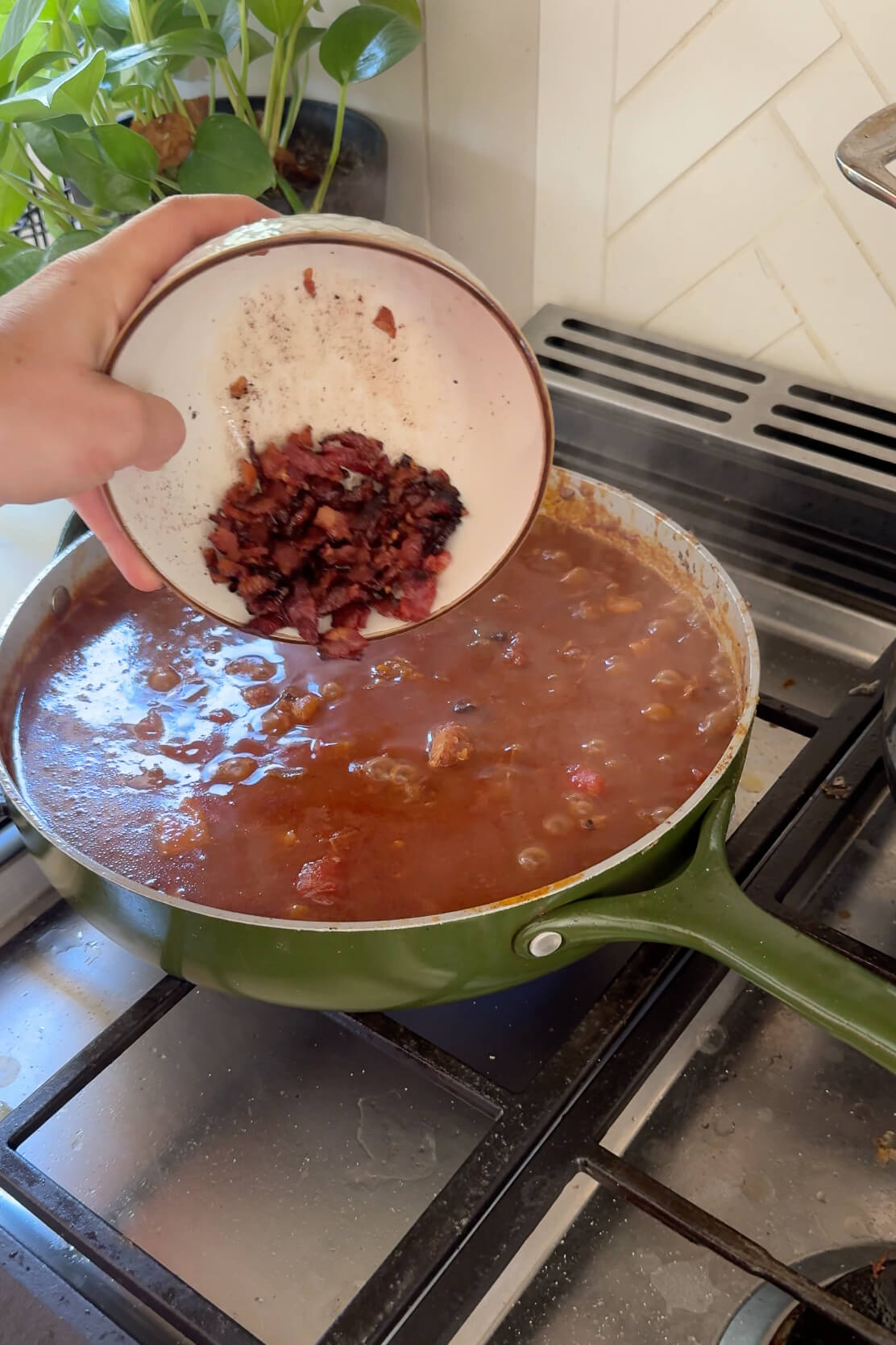 Adding bacon to my homemade brisket chili recipe.